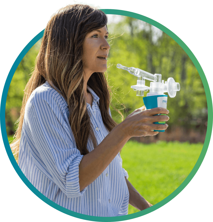 patient holding TYVASO Nebulizer inhaler